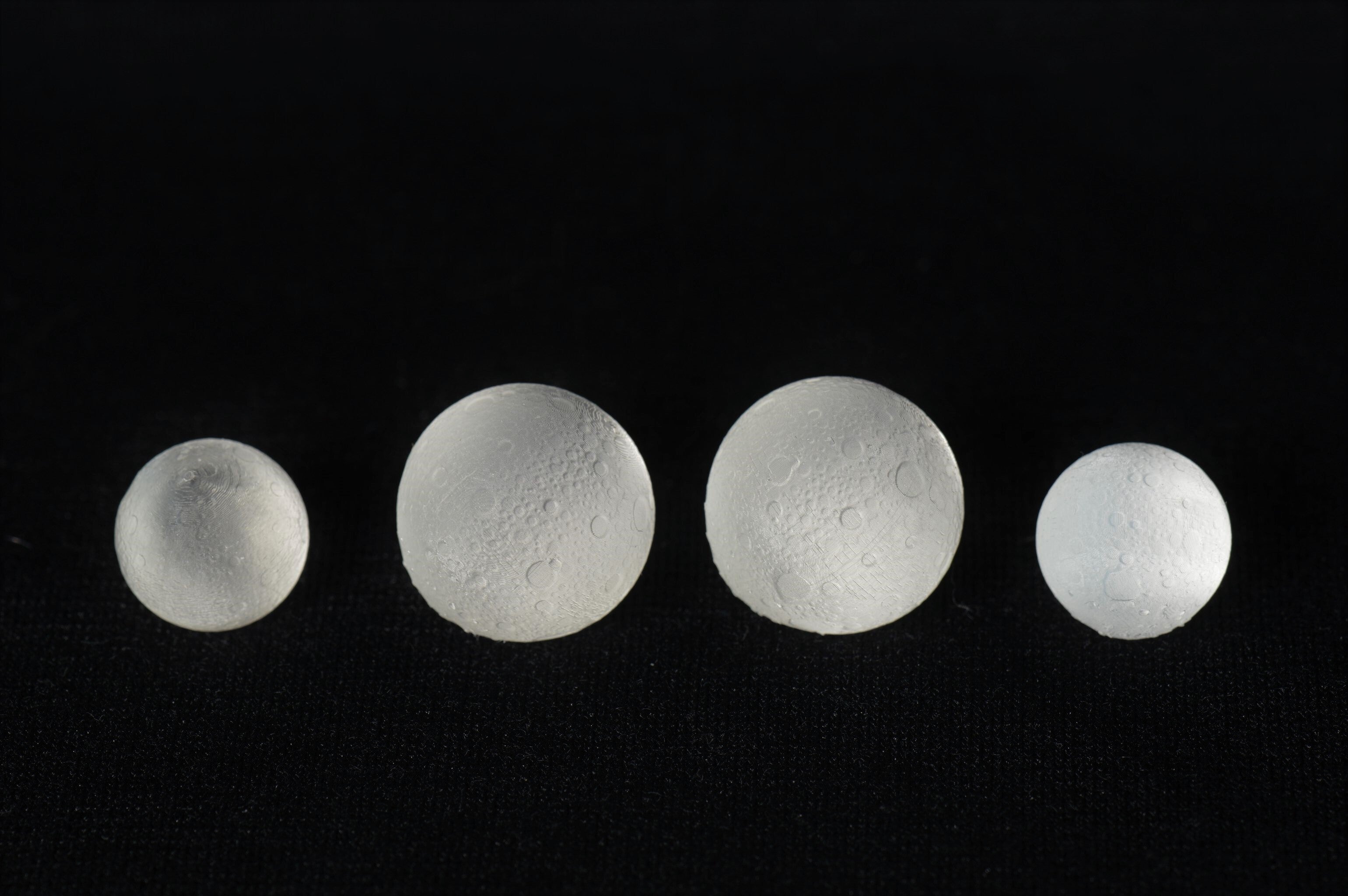 3D printed moon inclusions sized for standard sized dice